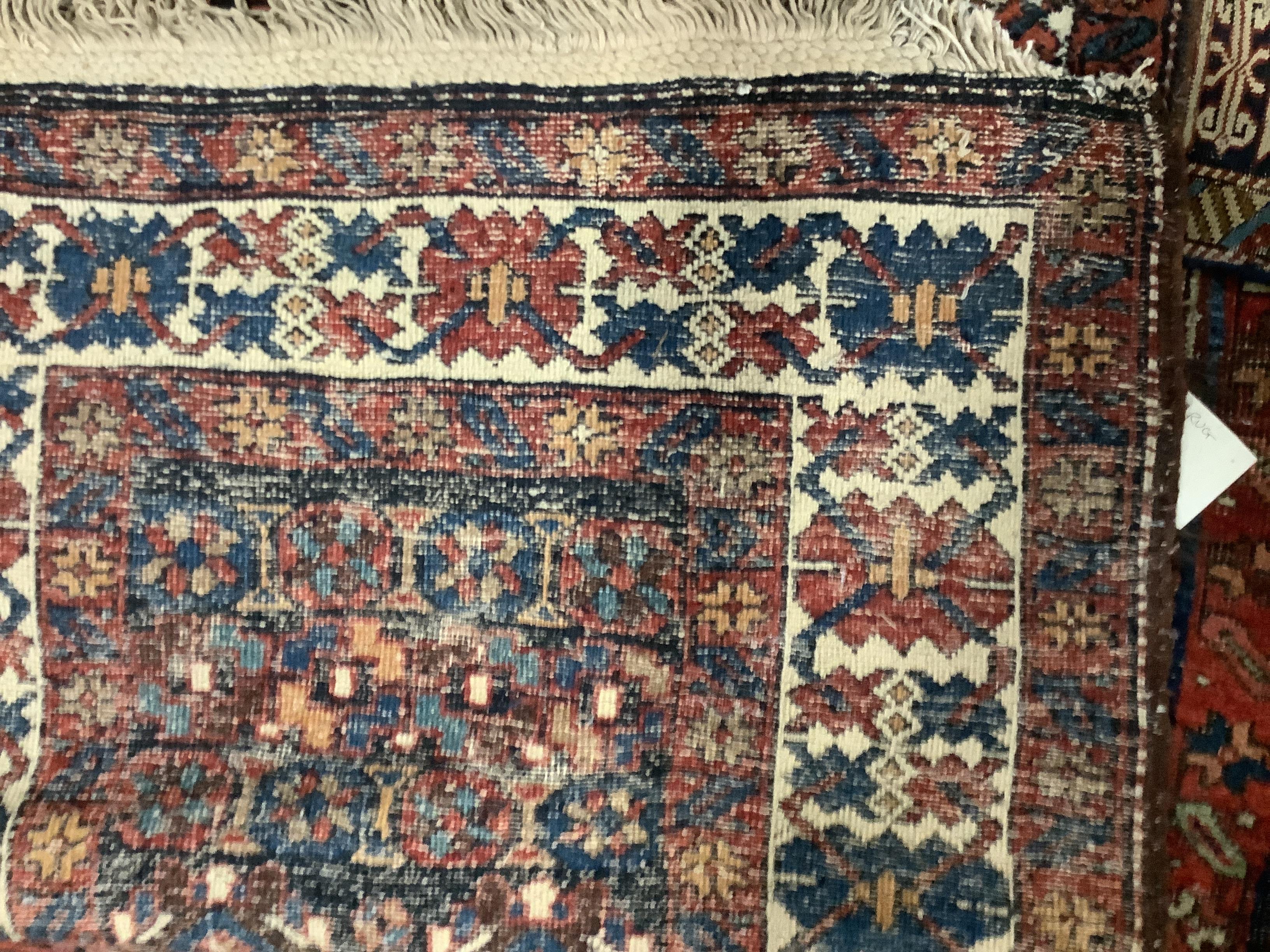 A Persian blue ground runner with field of stylised floral motifs, 428 x 83cm